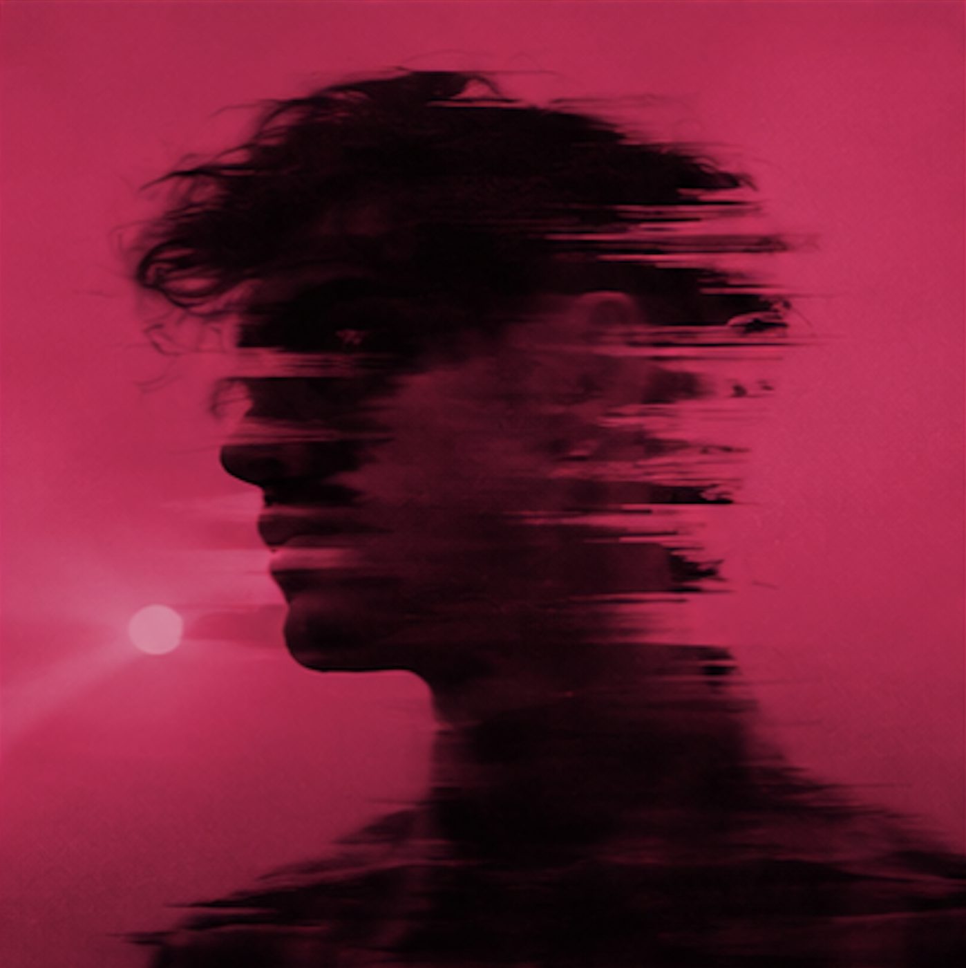A face dissolving into the dark